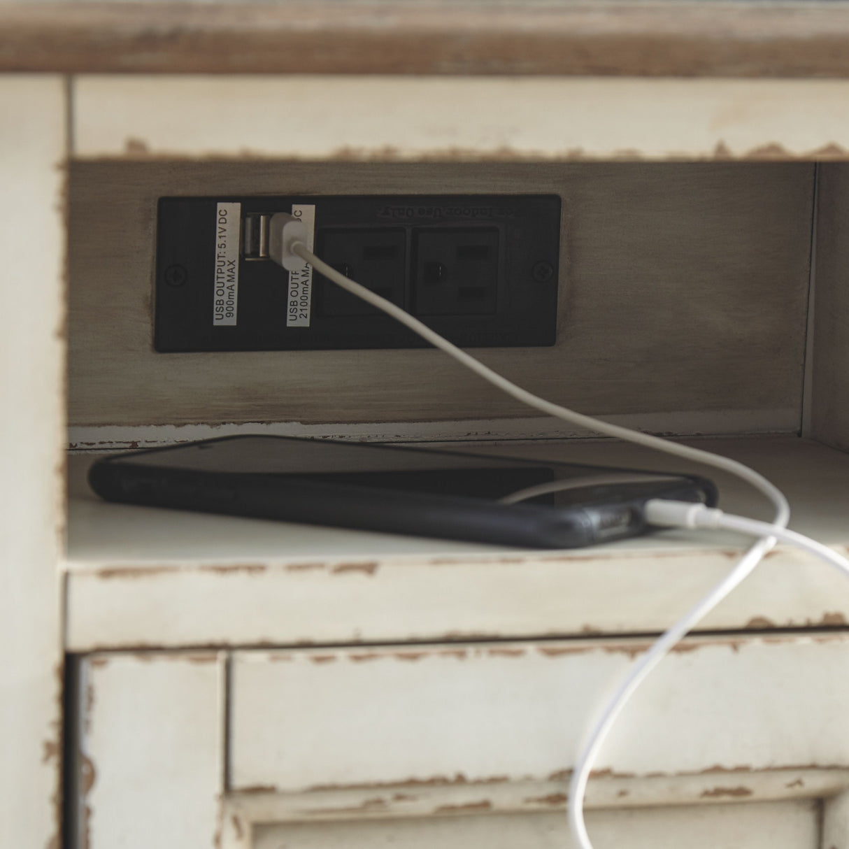 Realyn - White / Brown - Chair Side End Table - AC / USB by Signature Design by Ashley® | Bel Furniture