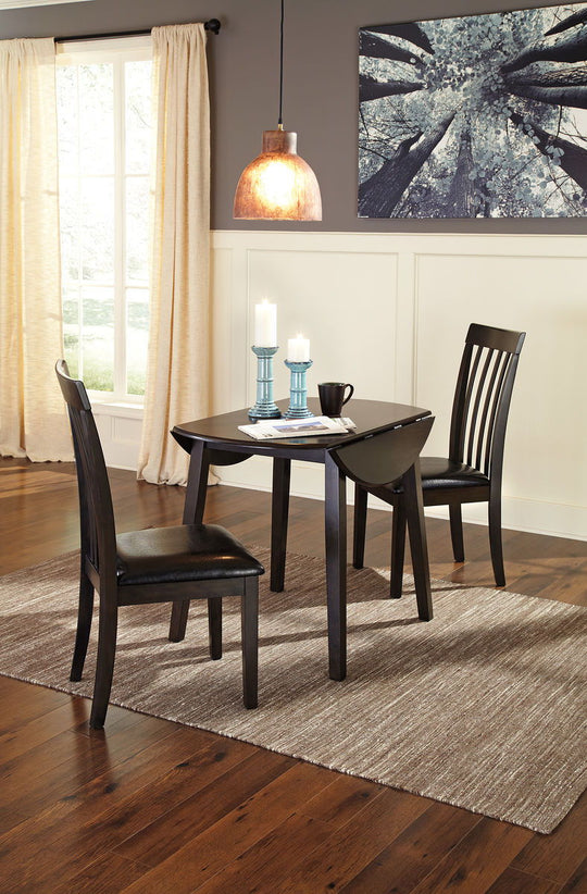Hammis - Round Dining Drop Leaf Table Set Dark Brown 3 Pc. - Round Dining Room Drop Leaf Table, 2 Upholstered Side Chairs by Signature Design by Ashley® | Bel Furniture