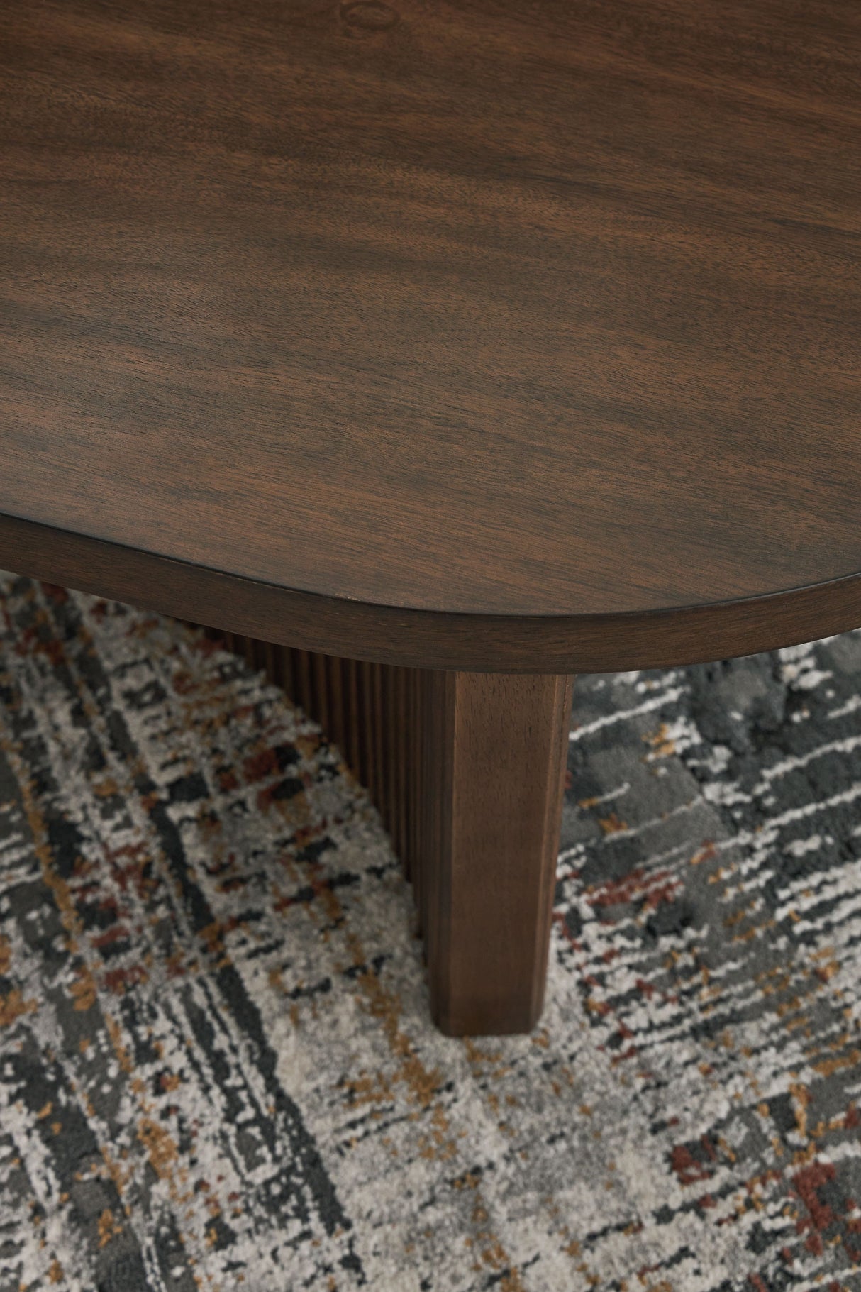Korestone - Dark Brown - Oval Cocktail Table by Signature Design by Ashley® | Bel Furniture