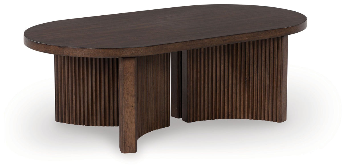 Korestone - Dark Brown - Oval Cocktail Table by Signature Design by Ashley® | Bel Furniture