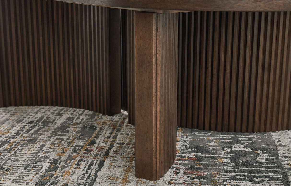 Korestone - Dark Brown - Oval Cocktail Table by Signature Design by Ashley® | Bel Furniture