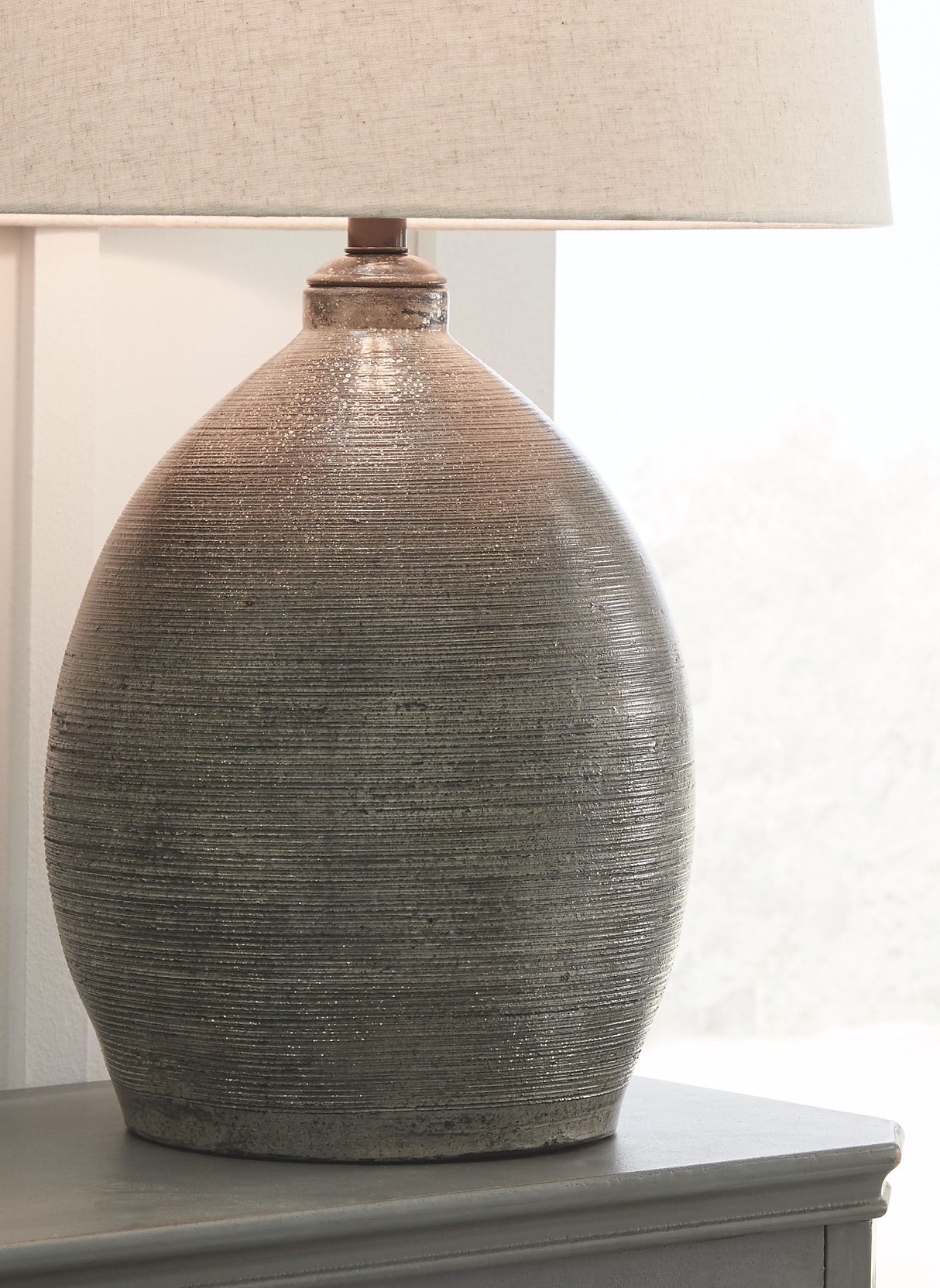 Joyelle - Gray - Terracotta Table Lamp by Signature Design by Ashley® | Bel Furniture