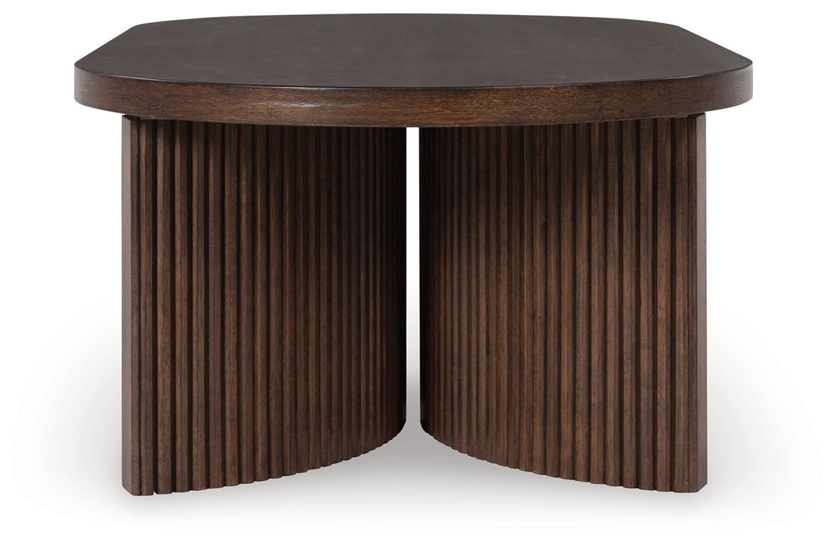 Korestone - Dark Brown - Oval Cocktail Table by Signature Design by Ashley® | Bel Furniture