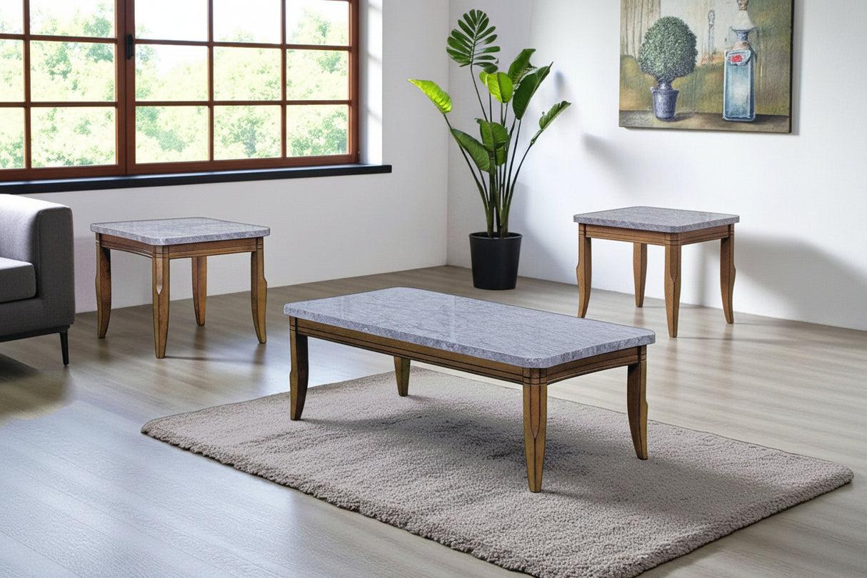 Set of wooden coffee tables with marble-like tops in a room with a large window and plant.