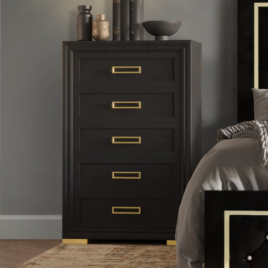 Modern bedroom with black upholstered bed and matching furniture.