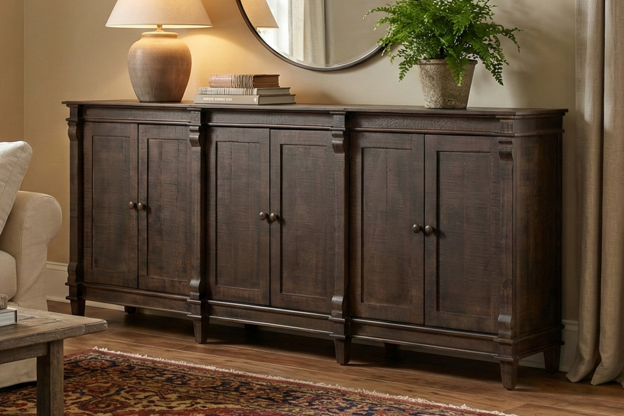 Living room with a wooden sideboard, sofa, and decorative items.