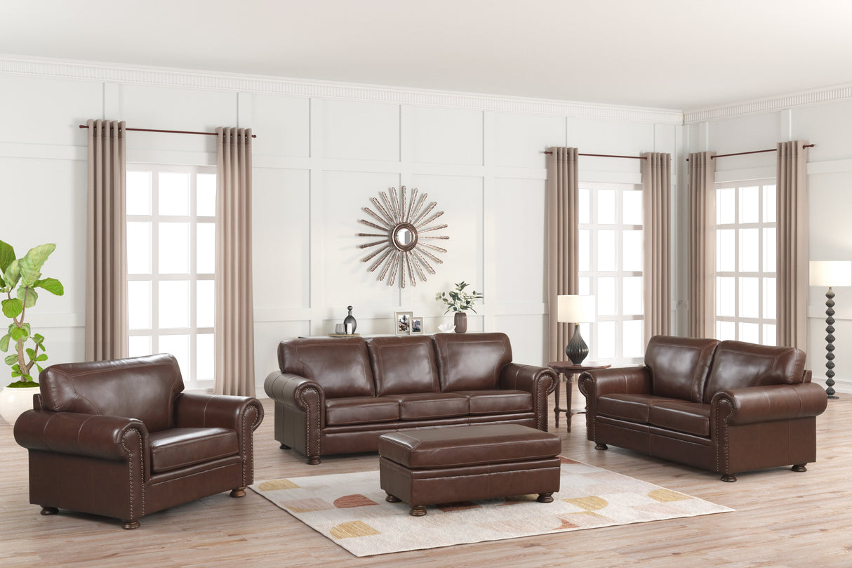 Brown leather sofa set in a living room with curtains and decor.