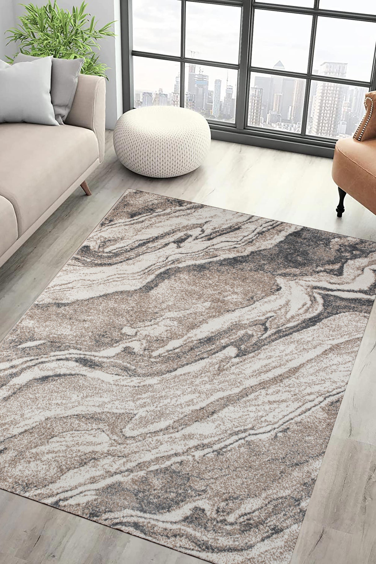 Living room with a marble-patterned rug, sofa, and ottoman.