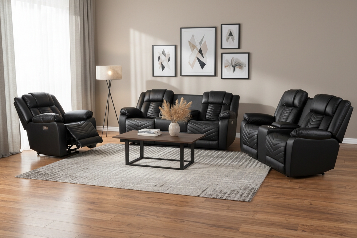 Black leather recliner sofa set in a living room with a coffee table and decorative items.