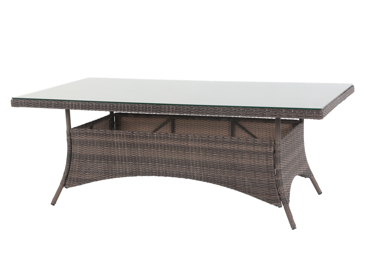Rectangular outdoor table with wicker frame and glass top on a white background