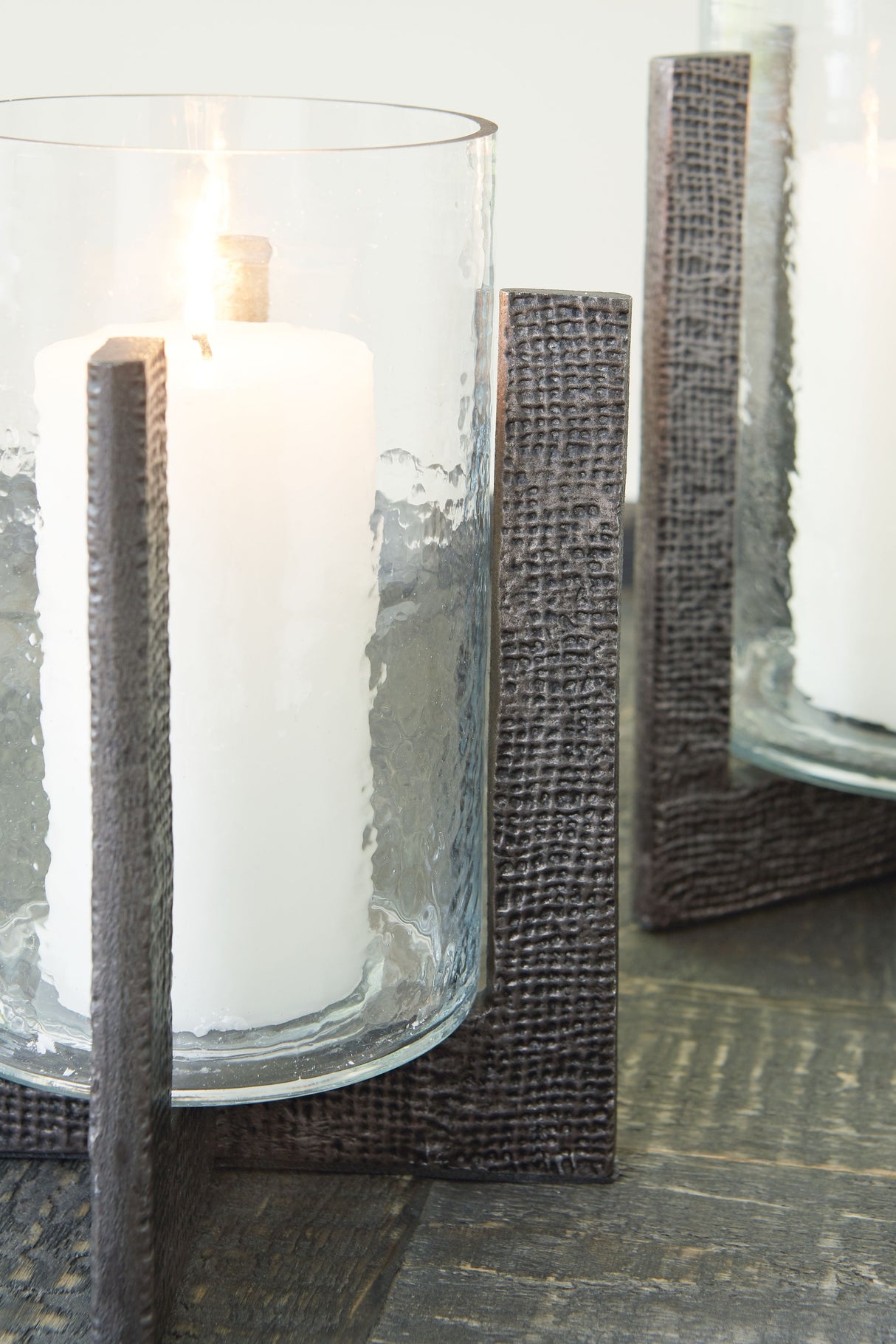 Garekton - Clear / Pewter Finish - Candle Holder Set (Set of 2) by Signature Design by Ashley® | Bel Furniture