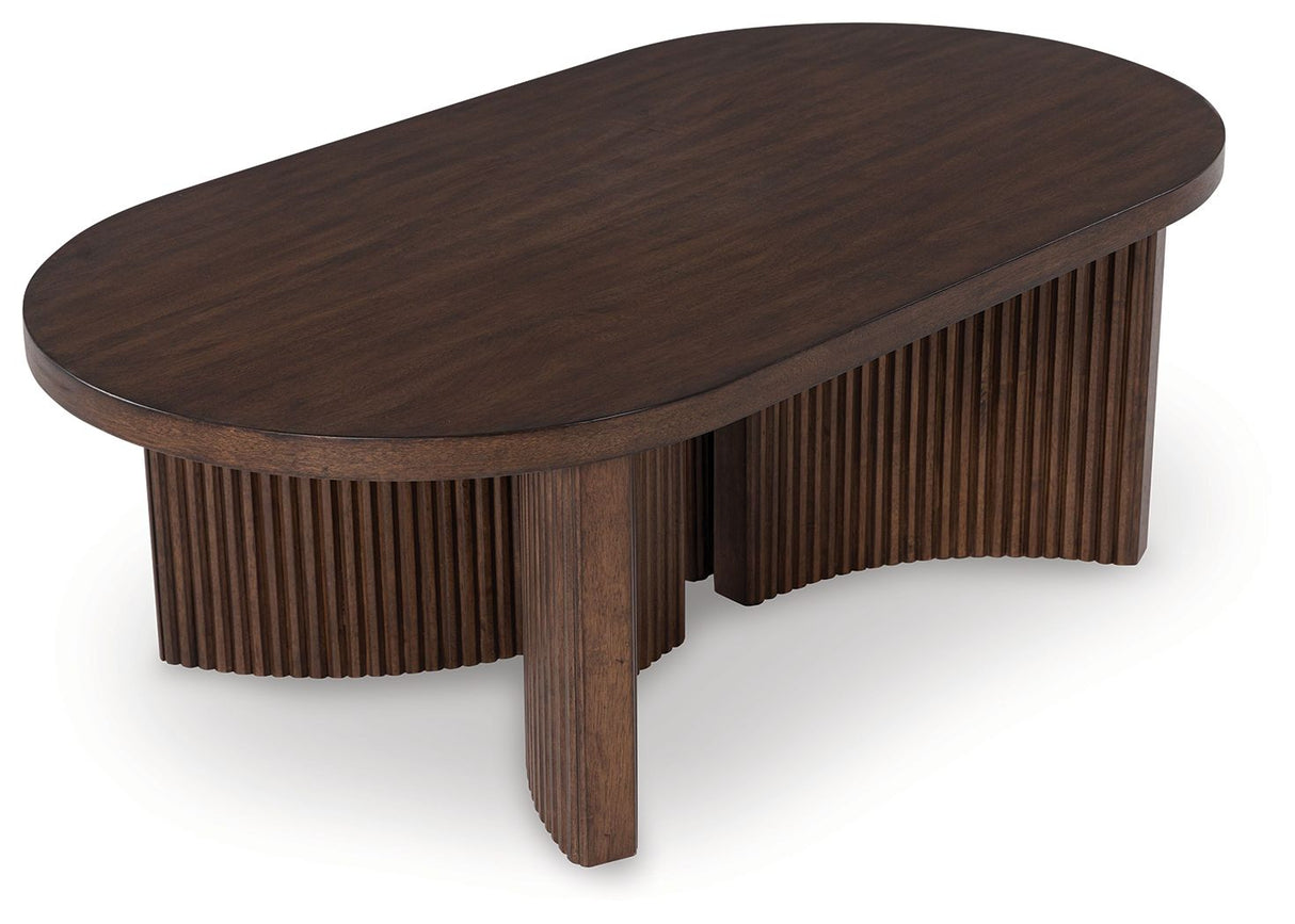 Korestone - Dark Brown - Oval Cocktail Table by Signature Design by Ashley® | Bel Furniture