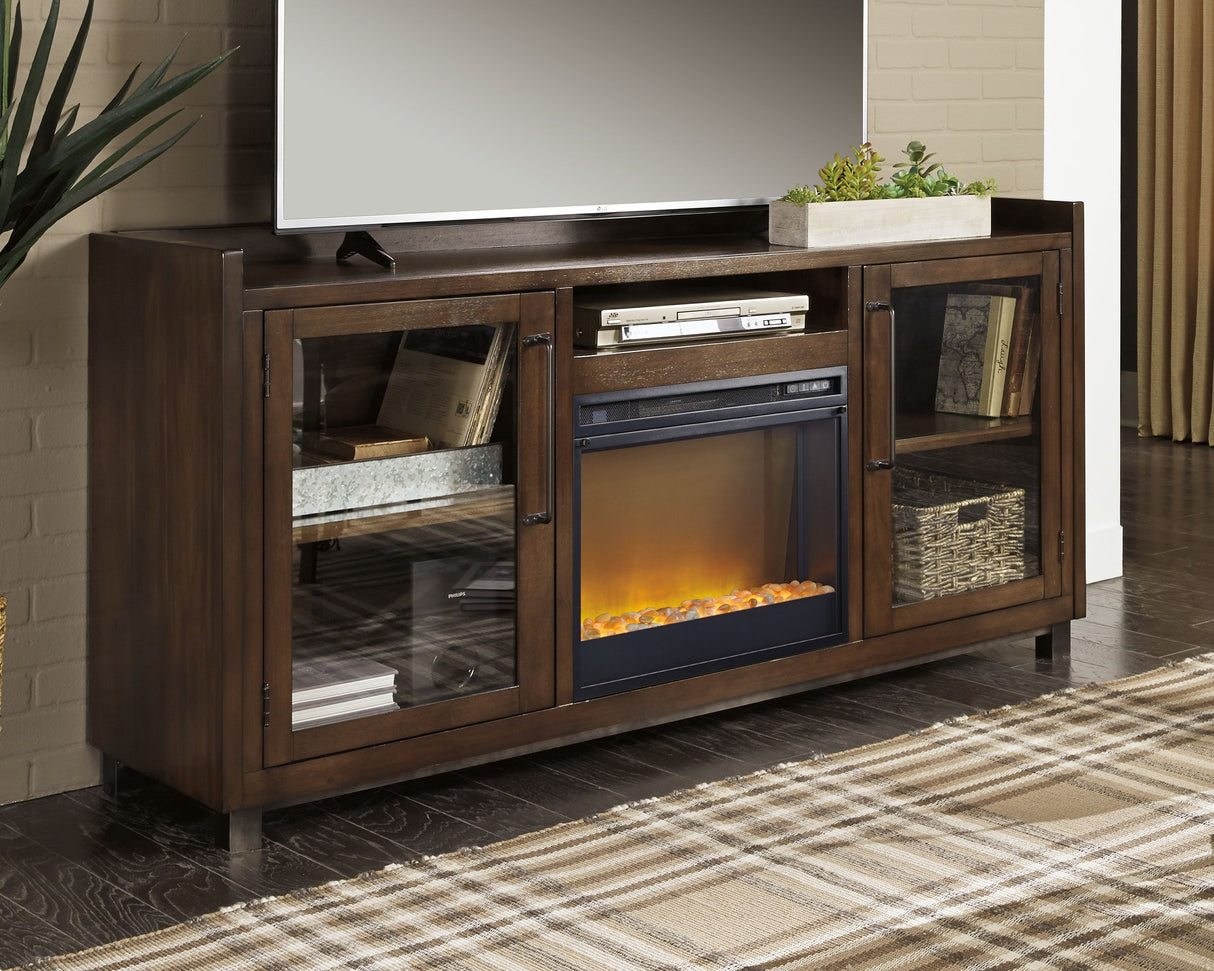 Starmore - Brown - 70" TV Stand With Glass/Stone Fireplace Insert by Signature Design by Ashley® | Bel Furniture