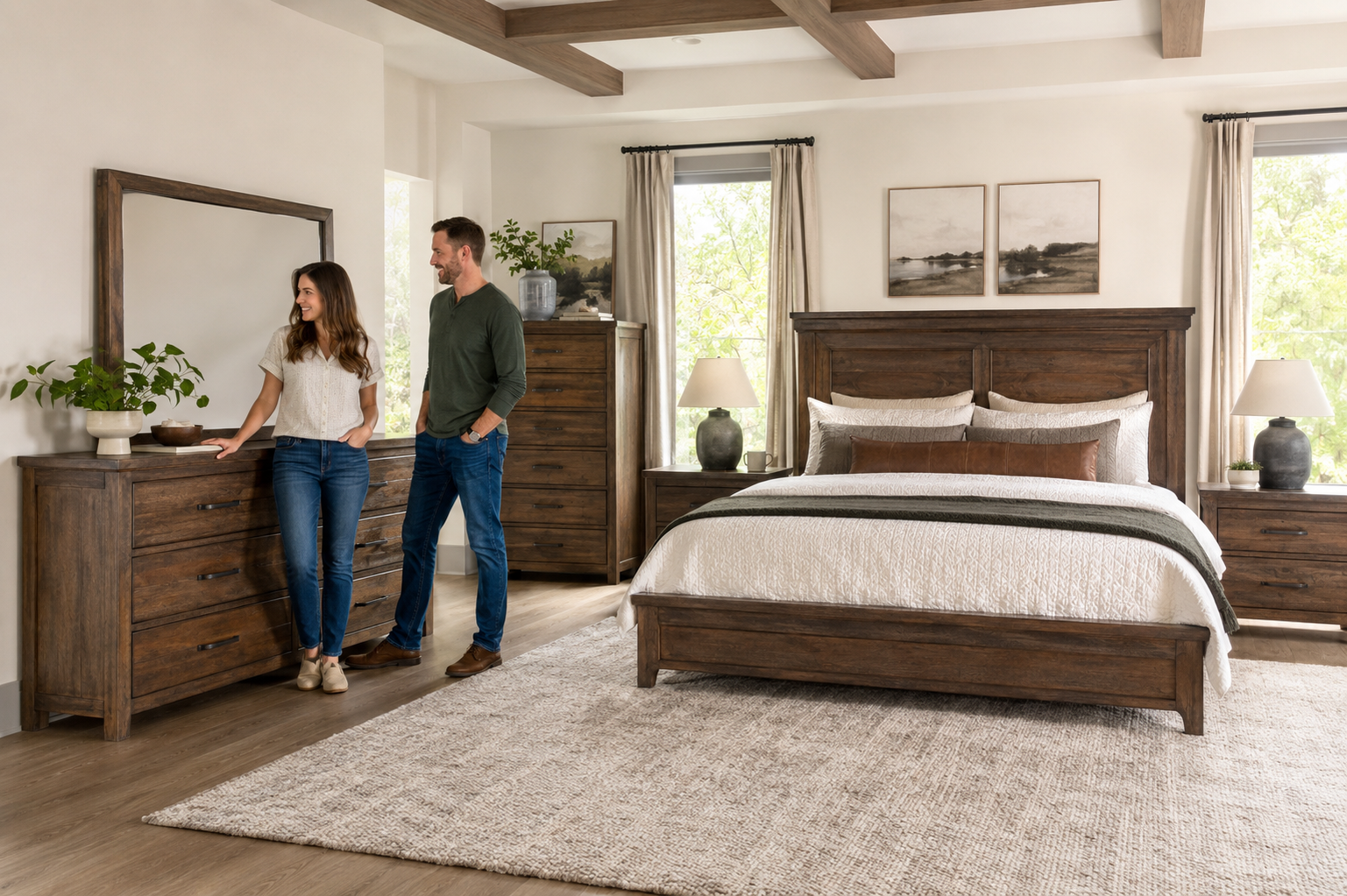 Couple comparing the pieces included in a coordinated bedroom set