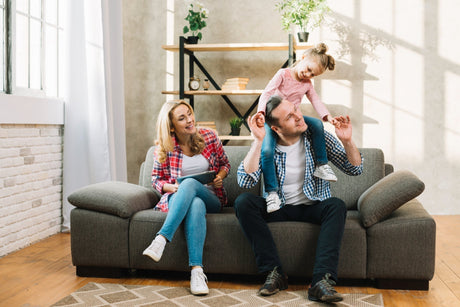 Family on Modern Sofa