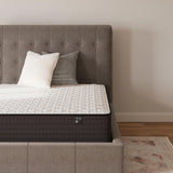 Sierra Sleep Limited Edition Firm innerspring mattress on gray upholstered bed with pillows - Bel Furniture