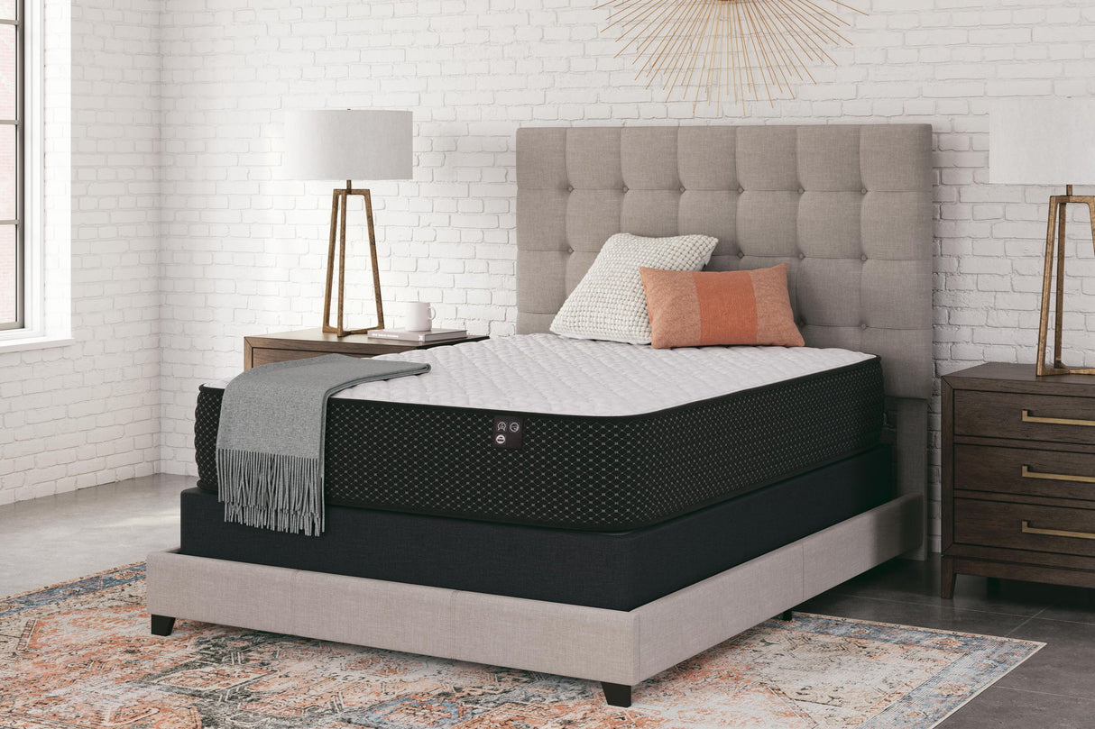 Limited Edition Firm innerspring mattress in black on beige bed frame with gray tufted headboard - Bel Furniture