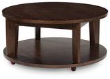 Korestone 2 - Dark Brown - Round Cocktail Table by Signature Design by Ashley® | Bel Furniture