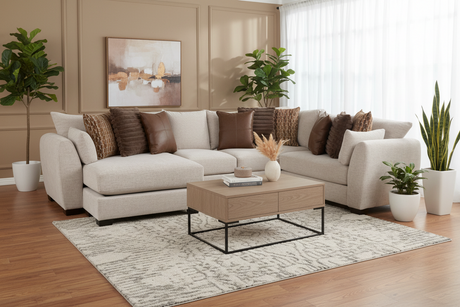 Modern living room with a beige sectional sofa, coffee table, and decorative elements.
