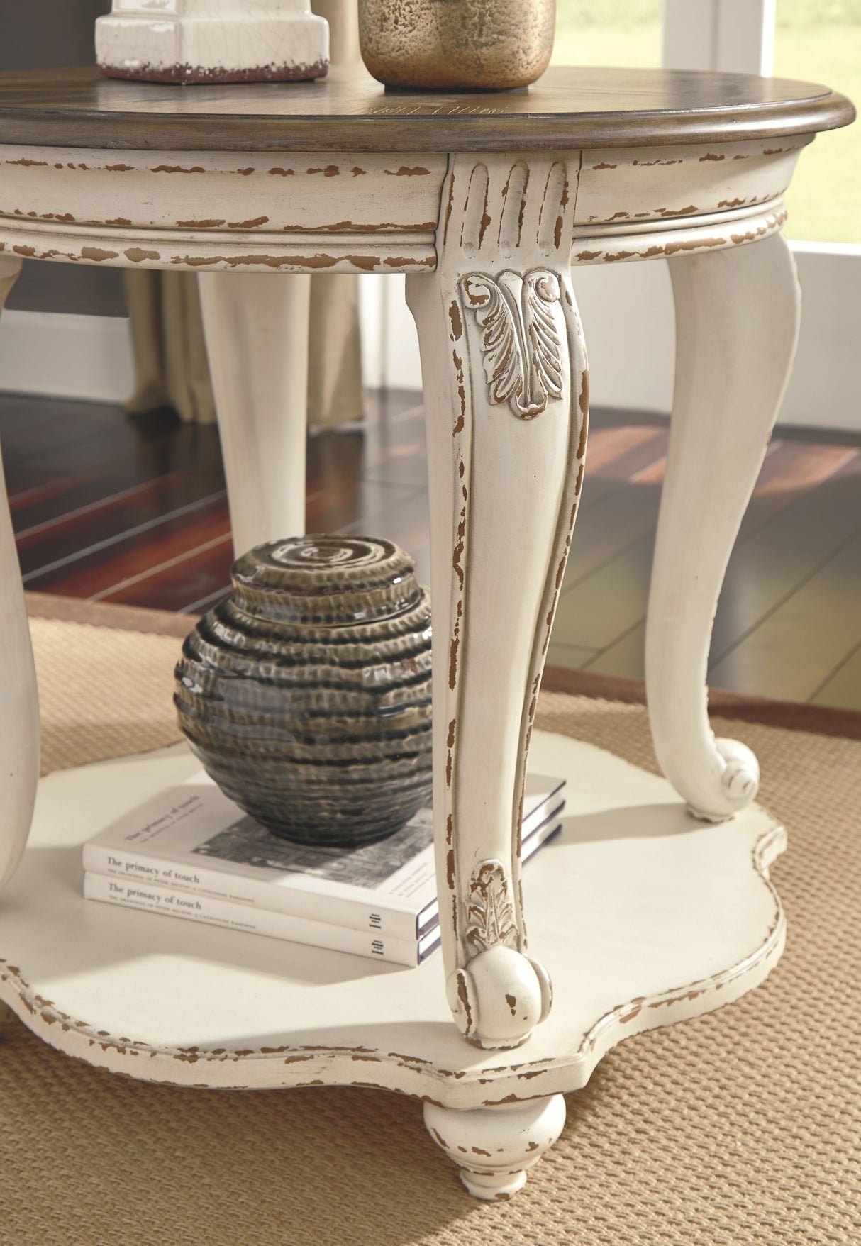 Realyn - White / Brown - Round End Table by Signature Design by Ashley® | Bel Furniture