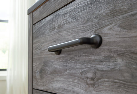 Bronyan - Dark Gray - Four Drawer Chest by Signature Design by Ashley® | Bel Furniture