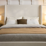 Caron - Upholstered Wingback Bed With High Headboard