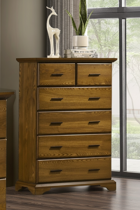Wooden dresser with multiple drawers in a room with a window and decorative items.