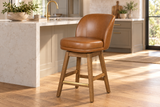 Brown Upholstered Swivel Bar Stool with Curved Back, Natural Wood Frame & Gold-Tone Footrest