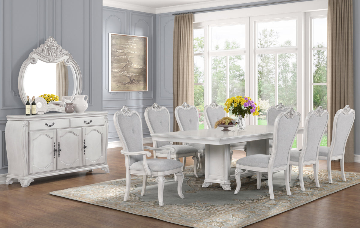 Elegant dining room with white furniture and decorative elements.