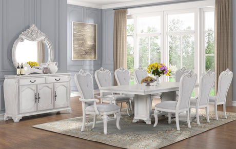 Elegant dining room with white furniture and decorative elements.