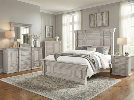 Neatly arranged bedroom with gray furniture including a bed, dresser, and nightstands.