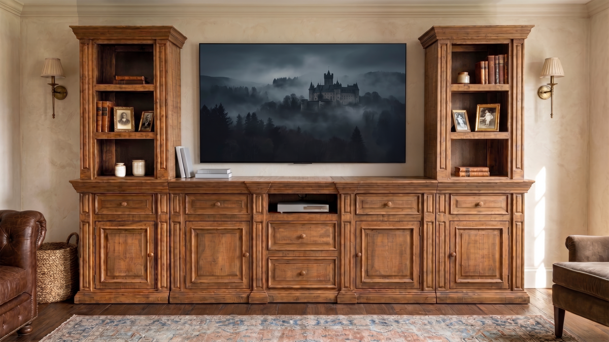 Wooden entertainment center with a television displaying a castle in the fog, flanked by bookshelves.