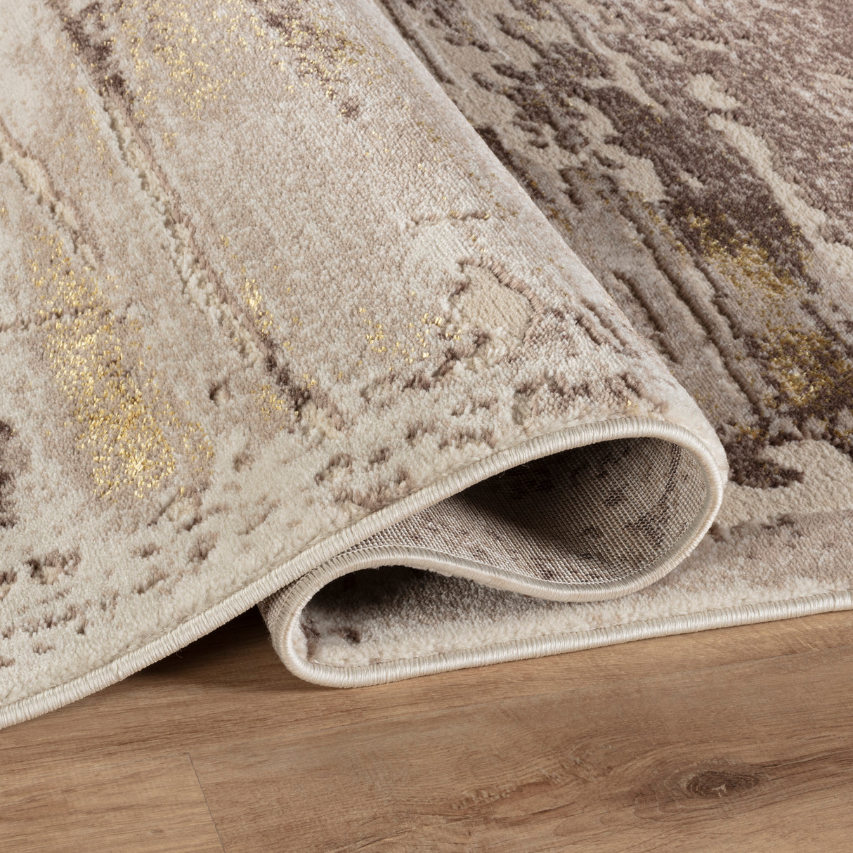 Textured area rug with a pattern on a wooden floor