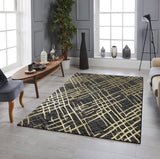 Living room with a black and gold patterned rug, coffee table, and decorative items.