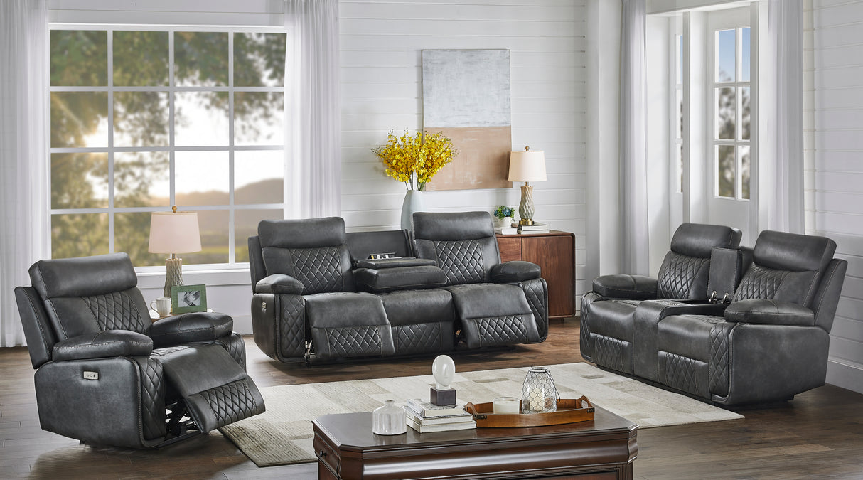 Gray reclining sofa set in a living room with large windows and decor.