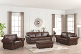 Brown leather sofa set in a living room with curtains and decor.