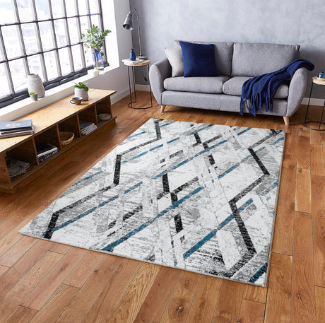 Living room with a geometric patterned rug, gray sofa, and wooden coffee table.