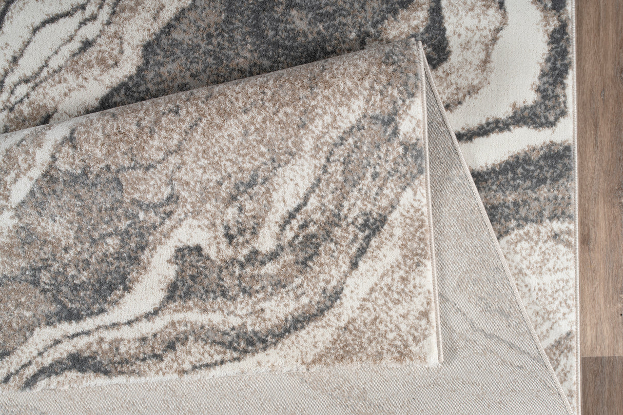 Close-up of a patterned rug on a wooden floor