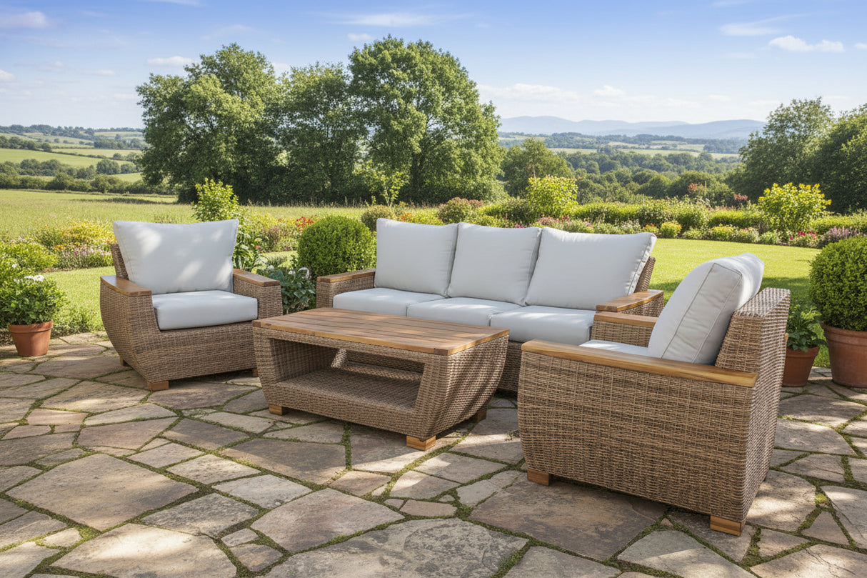 Wicker outdoor furniture set with cushions on a white background