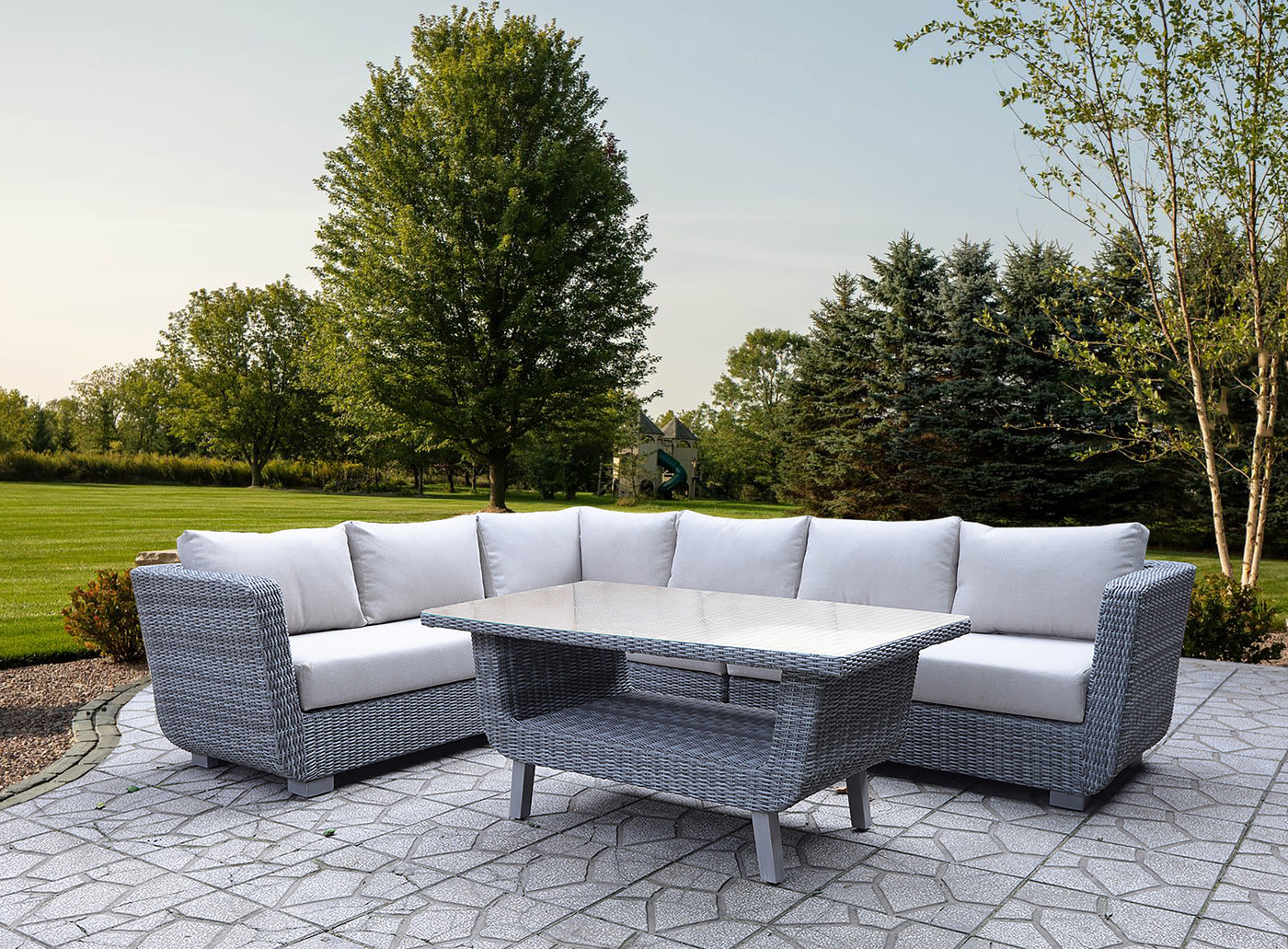 Five-piece outdoor wicker sectional patio set with coffee table on a covered patio