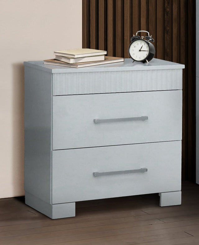 Modern bedroom set with white furniture, including bed, nightstands, and dresser.