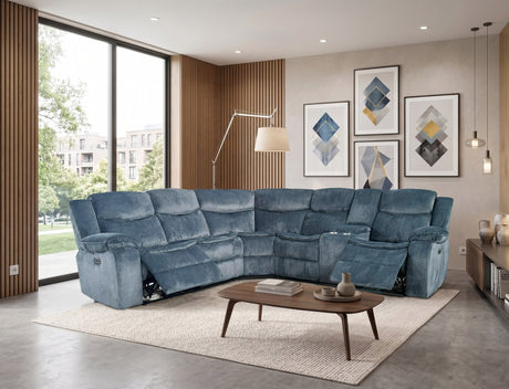 Blue sectional sofa in a modern living room with large windows and decorative wall art.