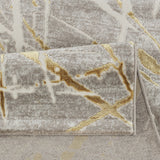 Gray rug with gold abstract patterns on a matching background