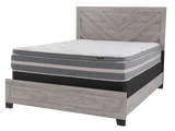 Mattress on a wooden bed frame with a white background