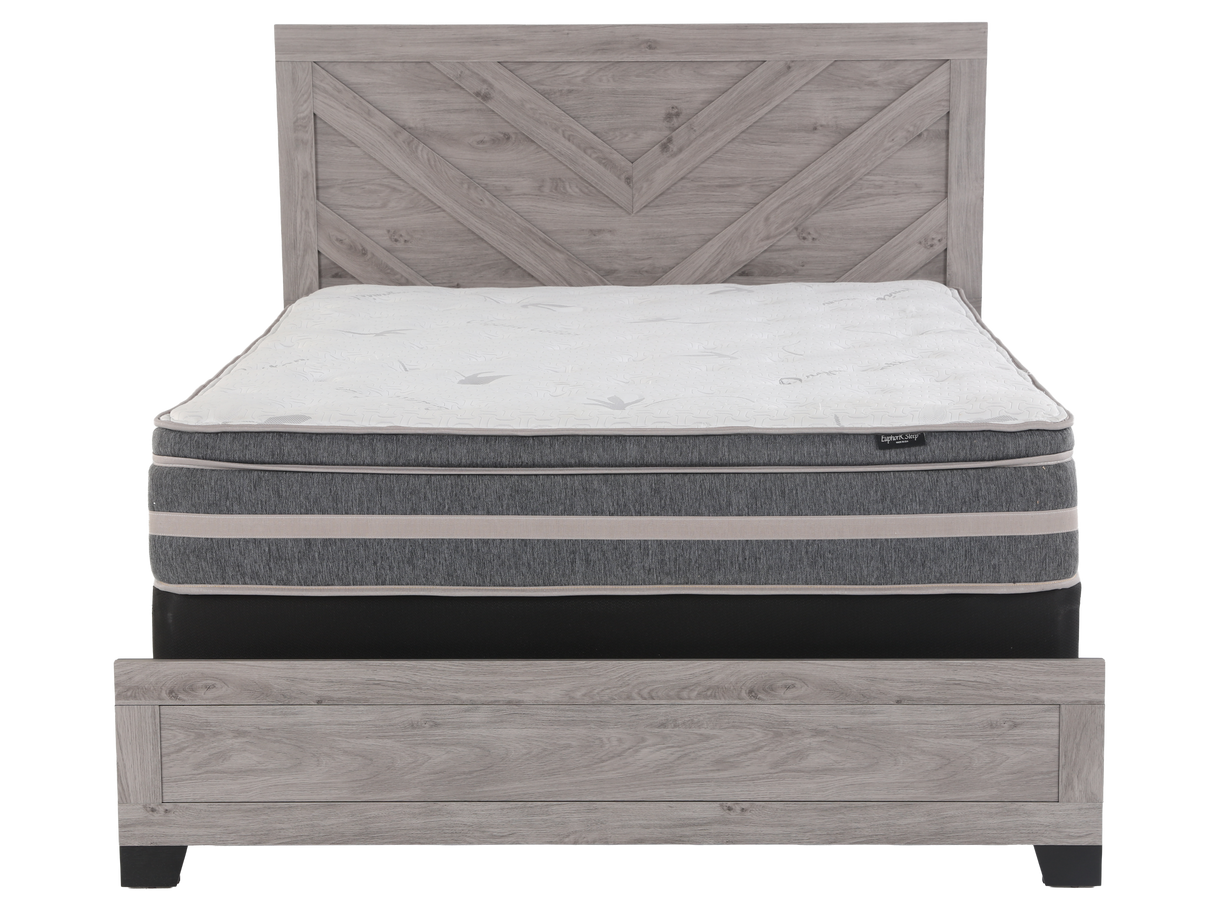 Mattress on a wooden bed frame with a white background