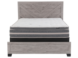 Mattress on a wooden bed frame with a white background