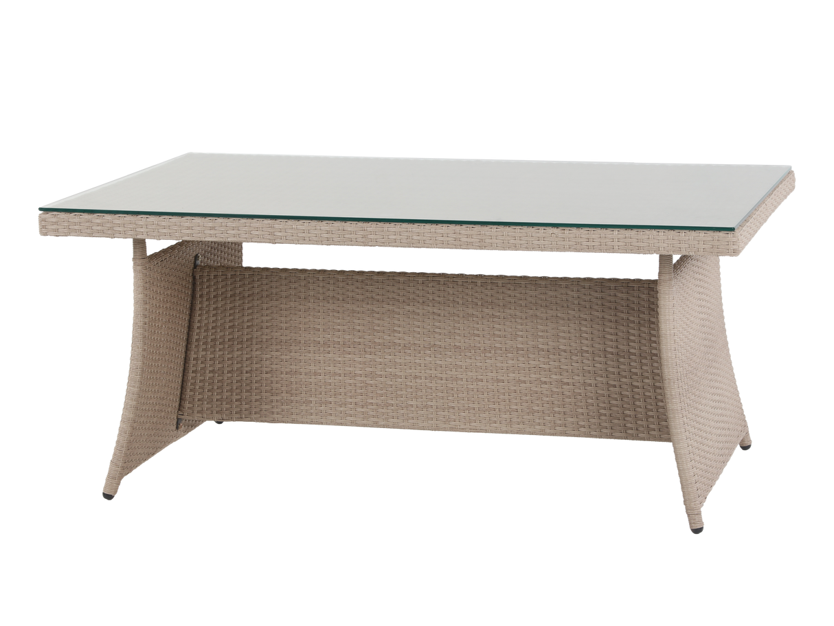 Outdoor table with wicker frame and glass top on a white background