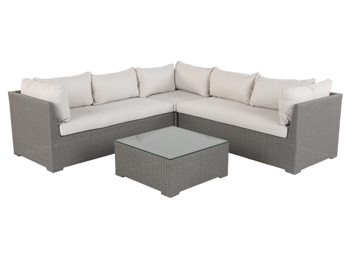 Sectional outdoor sofa with cushions and a coffee table on a white background