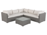Sectional outdoor sofa with cushions and a coffee table on a white background