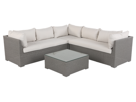 Sectional outdoor sofa with cushions and a coffee table on a white background